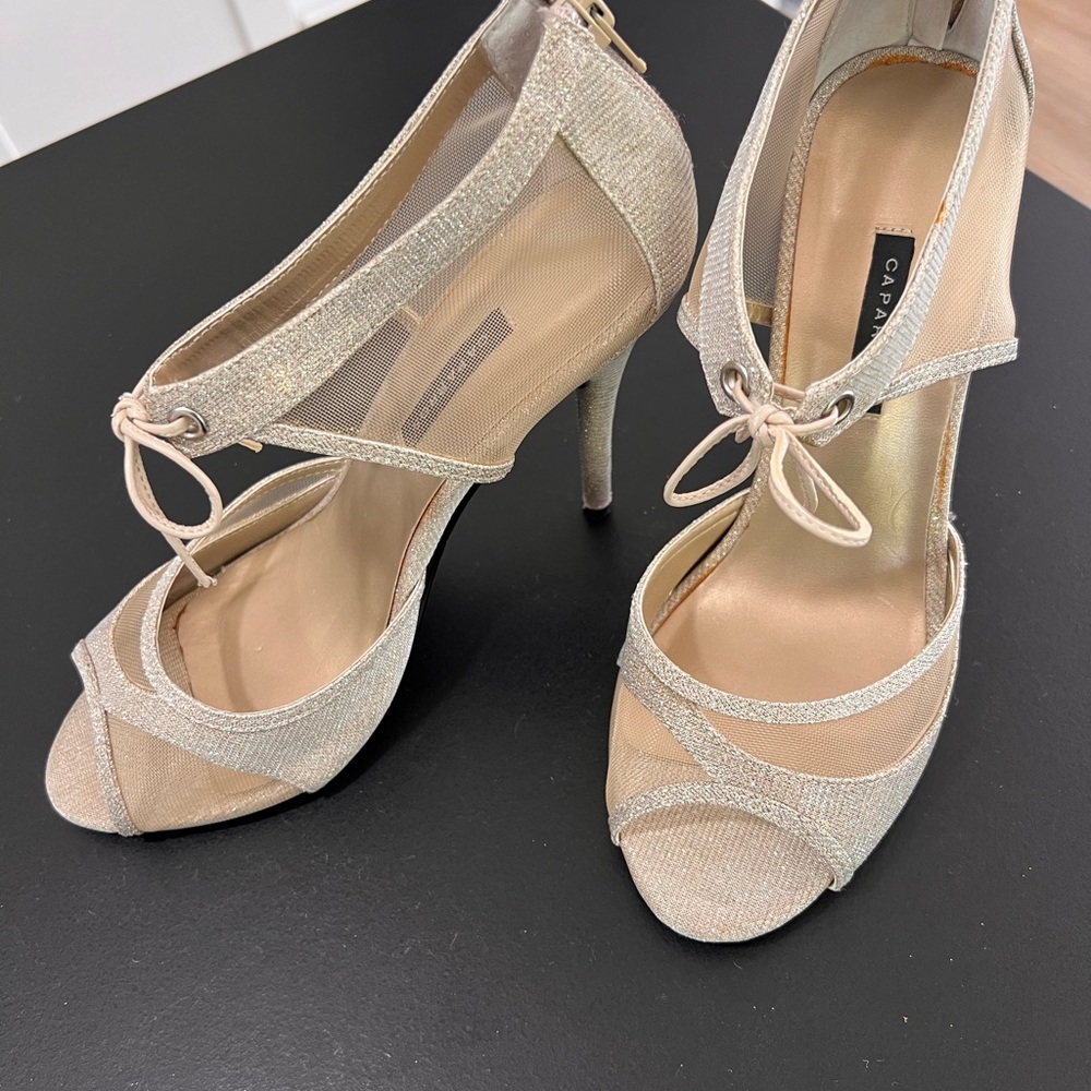 CAPARROS 4”, zipper back, bow tied at front ankle. Shimmer, w sheer sides.